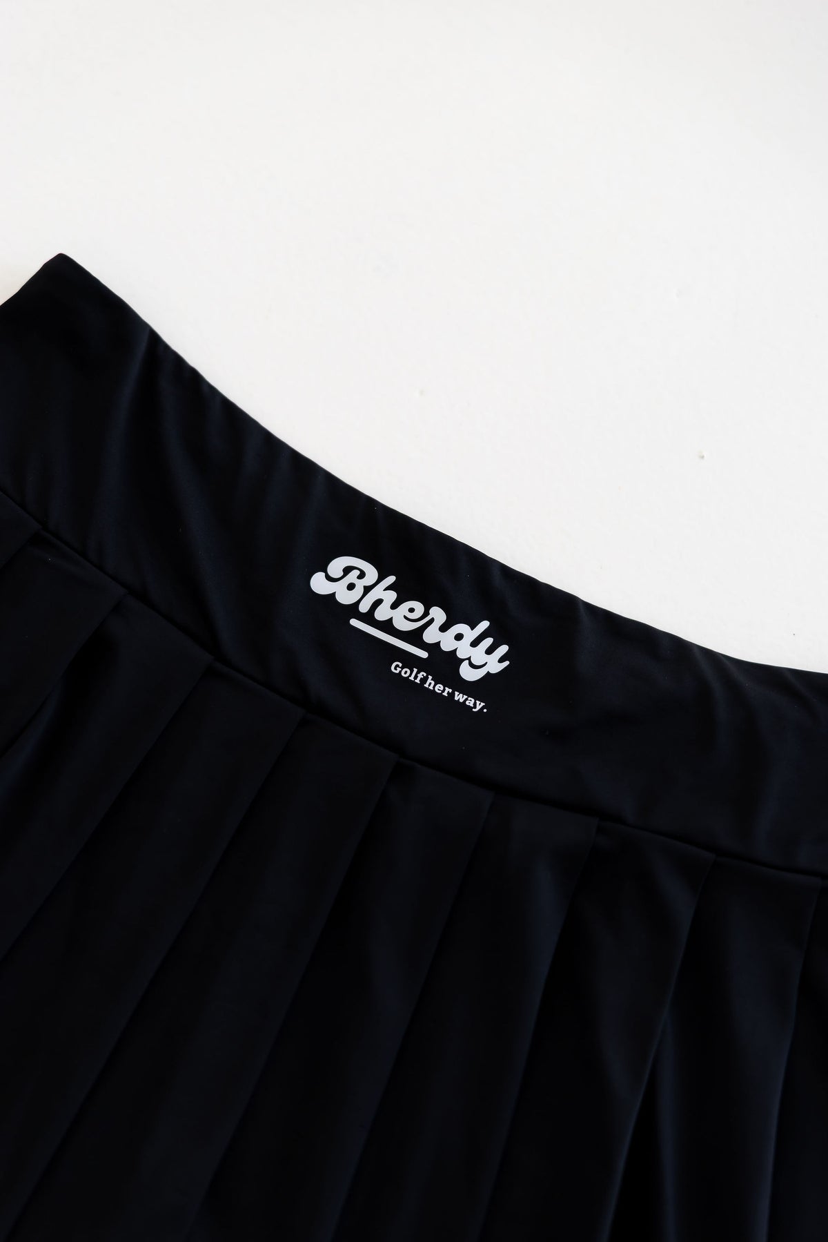 Women's water-resistant golf skort side view — four-way stretch — Bherdy Golf