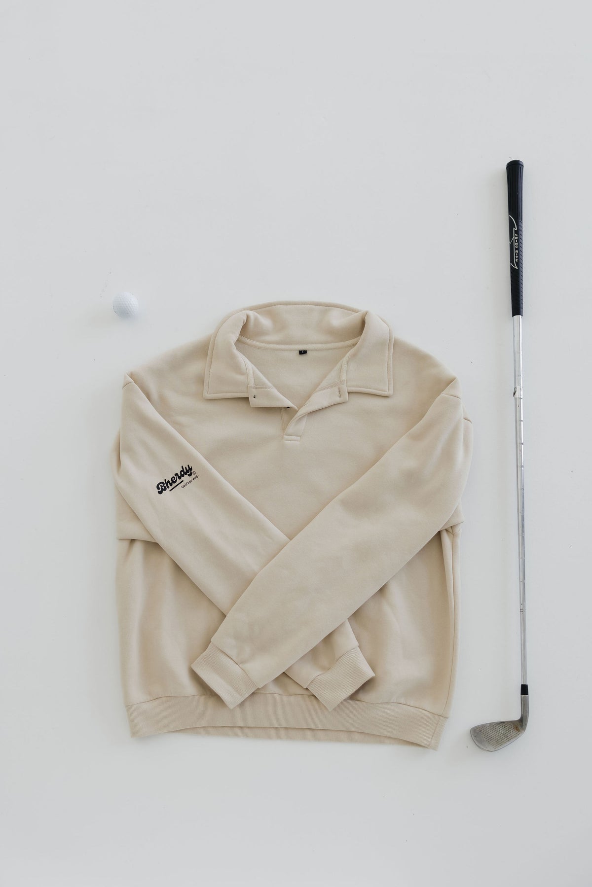 Women wearing Bherdy collared golf crewneck on the course