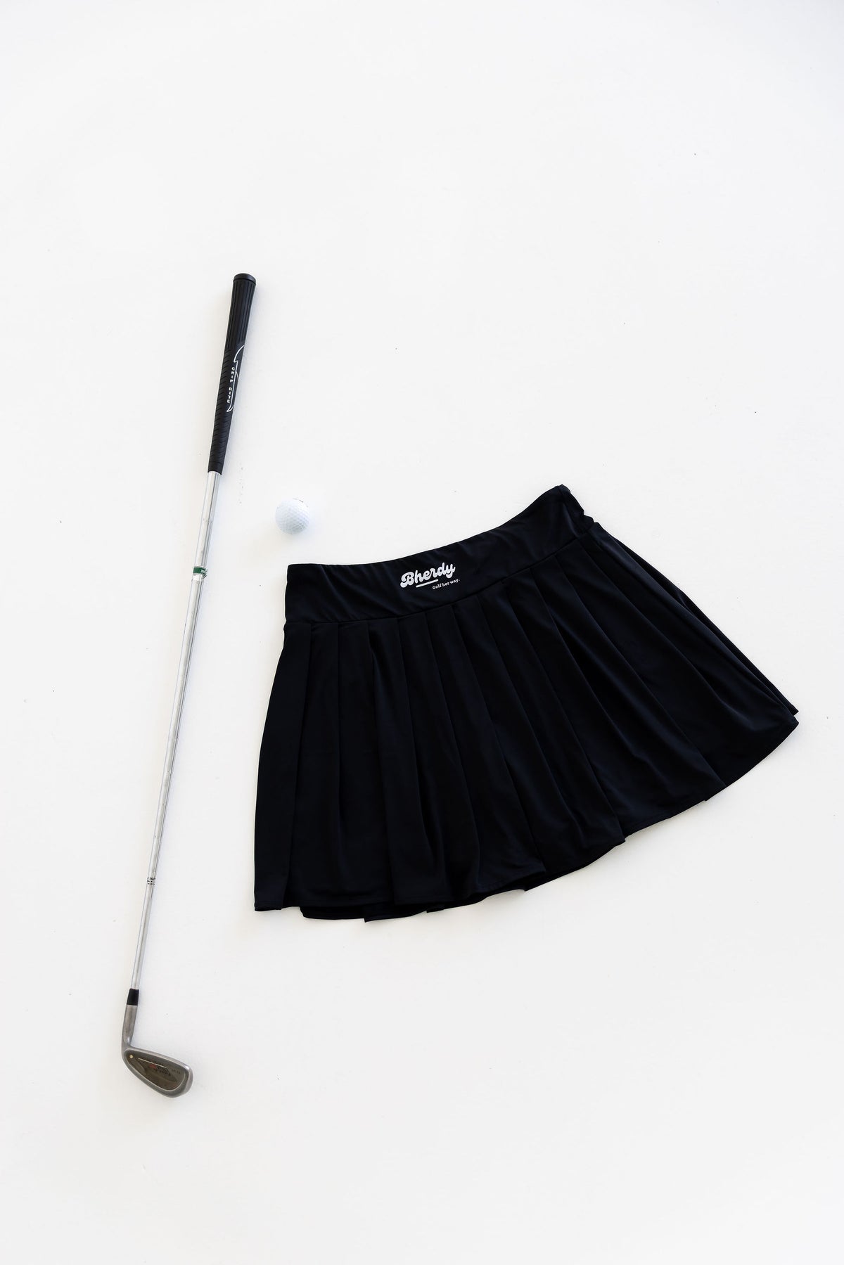 Women's golf skort swinging — mobility-focused design — Bherdy Golf