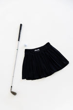Women's golf skort swinging — mobility-focused design — Bherdy Golf