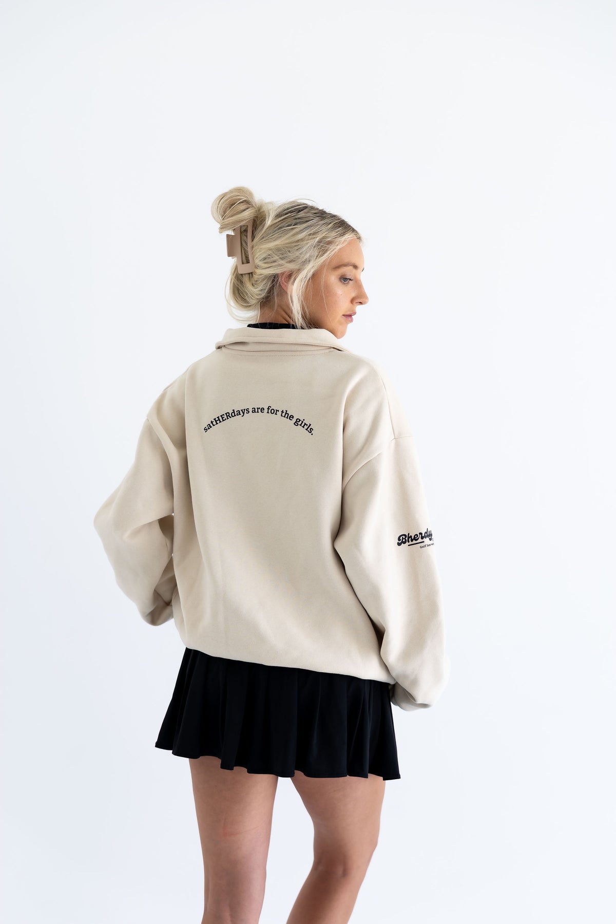 Women's golf outfit featuring Bherdy collared crewneck — black and beige